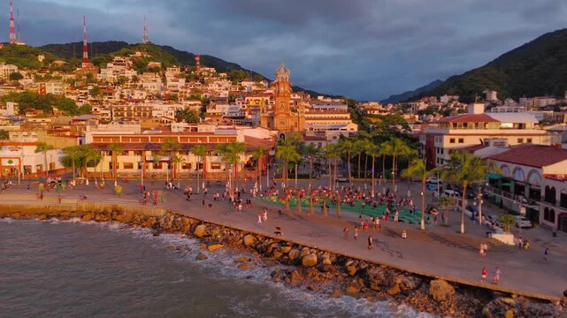 Aerial drone footage of Puerto Vallarta iconic church at sunset,