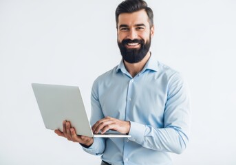 Smiling bearded businessman holding a laptop and working on it isolated on white background