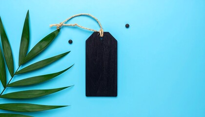 A black label with string and leaf on blue background