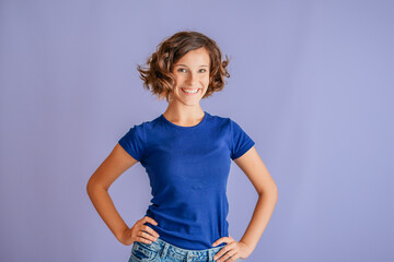Strong smiling young girl displaying confident pose with proud smile for success concepts on...