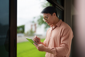 Focused Professional Taking Notes in Modern Workspace