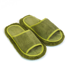 Green terry cloth open toe slippers with fuzzy microfiber soles and soft trim isolated on white background