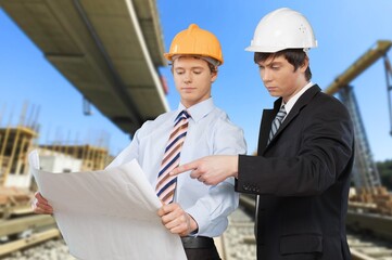 Construction Engineering worker discusses plan the building