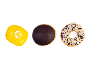 Chocolates donut close-up on a white background. Colorful Chocolate covered donuts with colorful sprinkles.