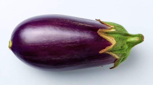 A single purple eggplant with a green leafy stem placed beside a small yellow mark on a clean white background.