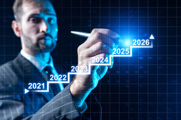 Businessman drawing timeline with steps from 2021 to 2026 symbolizing growth, future planning, success strategy and financial progress, Business Industry.
