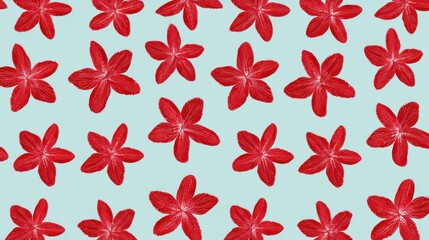 A vibrant pattern of red five-petaled flowers arranged dynamically on a light blue background,