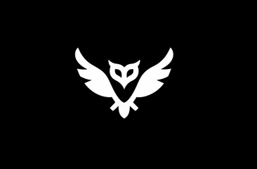 Abstract white owl icon on a stark black background. Simple elegant bird symbol, vector illustration for design.