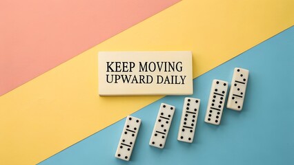 Dominoes and a message of keeping upward progress daily