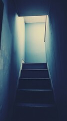 Dark,?interior?stairway?with?light?at?top