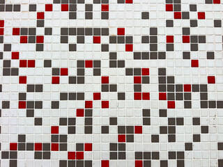 A view of small abstract ceramic tile on a wall, as a background.