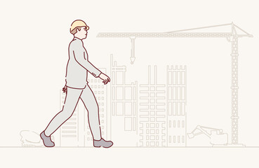 Walking architect at building site. Confident construction manager wearing hardhat. Successful mature civil engineer at construction site. Project management, engineering and safety inspection.
