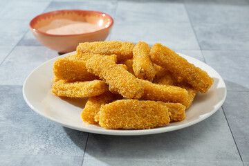 A view of a plate of gluten-free fish sticks.