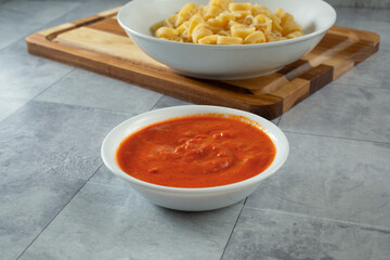 A view of a bowl of pink pasta sauce.