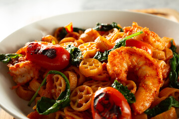 A closeup view of a gluten-free pasta wheel entree.
