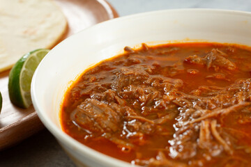 A closeup view of a bowl of beef birria.
