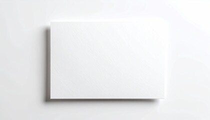 A blank, textured white rectangular card floats, casting a shadow on a plain white surface