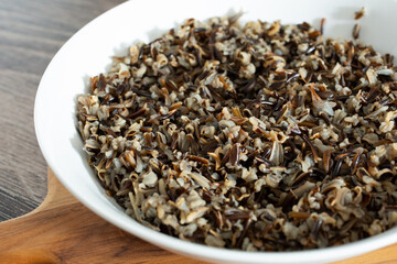 A view of a bowl of cooked wild rice.