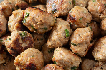 A top down view of a pile of meatballs, as a background.