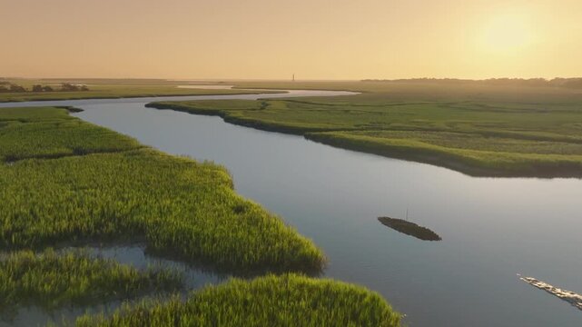 Lowcountry Light: Sunrise Over Charleston, South Carolina Marsh with Water and Lighthouse