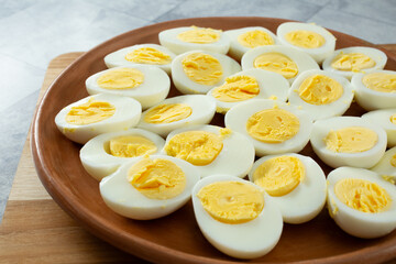A view of a plate of halved 12 minute hard boiled eggs.