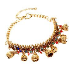 Ornate gold anklet with colorful bells and gems