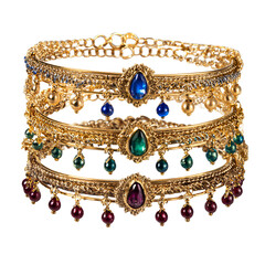 Gold ornate bracelets, layered, with gemstones