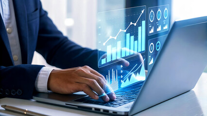 Dynamic businessman analyzing financial growth charts on futuristic digital interface while working on laptop