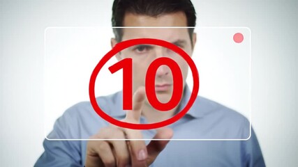 Man Touches Red Number Ten on Transparent Screen in Light Blue Shirt - Powered by Adobe