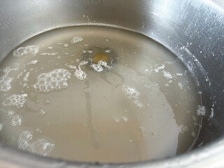 Metal sink with water. Clogged pipes.