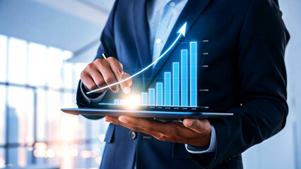 Confident businessman analyzes upward trending growth chart on digital tablet in modern office,...
