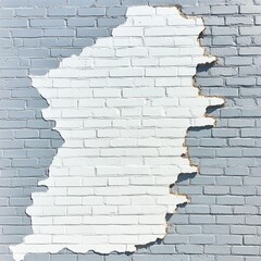 Partially painted brick wall with central white section