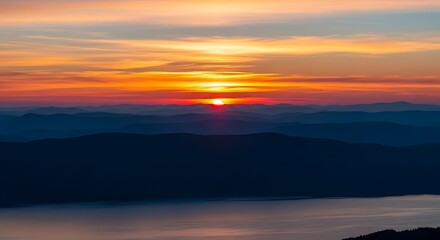 Fototapeta premium Vibrant Sunset Over Calm Waters and Distant Horizon.