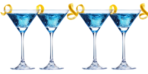 Four elegant blue martinis garnished with lemon twists
