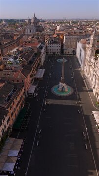 Remarkable and stunning aerial views capturing the essence of a vibrant Rome city, Piazza Navona square, showcasing a magnificent grand fountain and beautiful historic buildings that tell a story