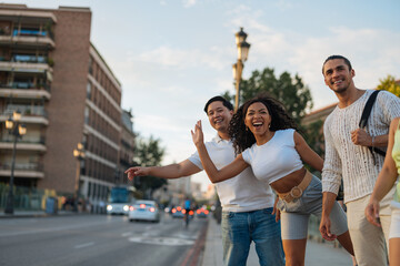 Tourists hailing taxi in Madrid, Spain during summer vacation