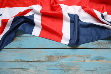 National flag of the United Kingdom on color wooden background