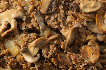 A top down view of a Philly cheesesteak with mushroom sandwich, as a background.
