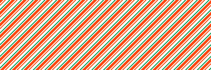 Green and red Christmas seamless pattern. Xmas diagonal stripes wallpaper. Candy cane peppermint repeating background. Winter holiday present wrapping paper design. Vector line decoration backdrop