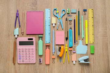 Set of school supplies on wooden background