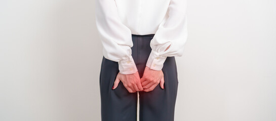 Business Woman having Anal symptoms pain for Hemorrhoids disease, Constipation, Anal cancer awareness month, diarrhea, Irritable Bowel Syndrome, IBS, Inflammation, Colorectal cancer and Anal Procttis