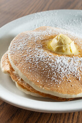 A view of a pancake stack, on a plate.