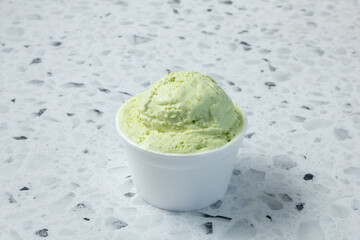 A view of a scoop of pistachio ice cream.
