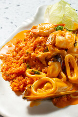 A closeup view of a plate of arroz con mariscos.
