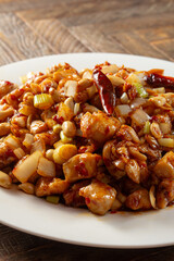 A view of a plate of kung pao chicken.