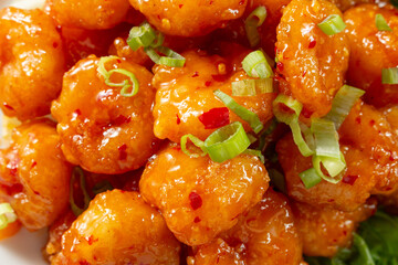 A top down view of a plate of crispy shrimp, as a background.