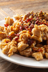 A view of a plate of spicy popcorn chicken.