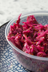 A closeup view of a container of slaw.