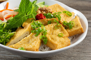 A view of a bowl of tofu bun.