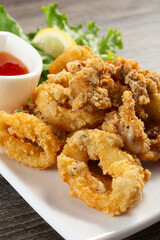 A closeup view of a plate of fried calamari.